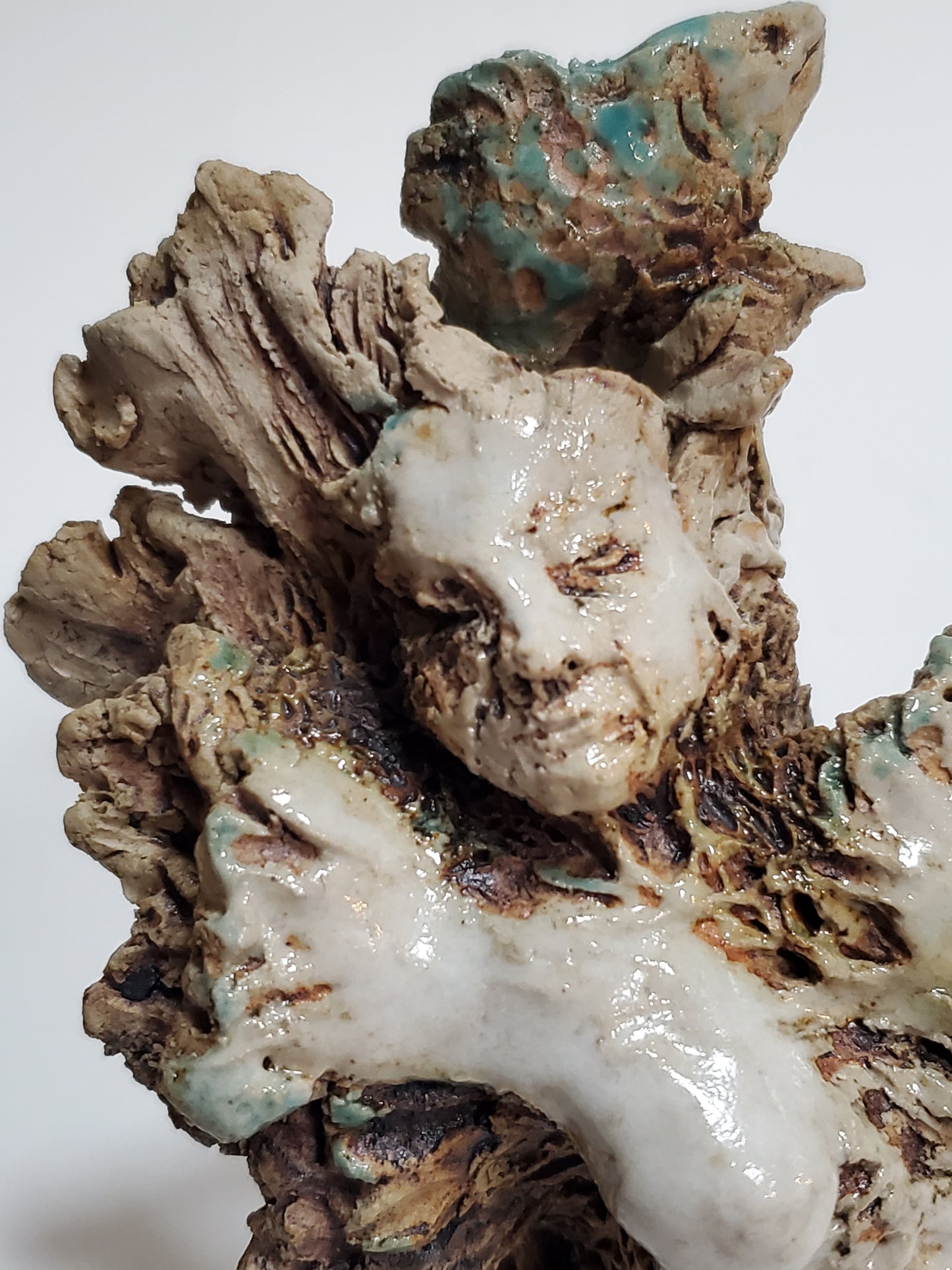 Set of 2 miniature ceramic sculptures, female figure with fish and shadow, figure with double-headed snake