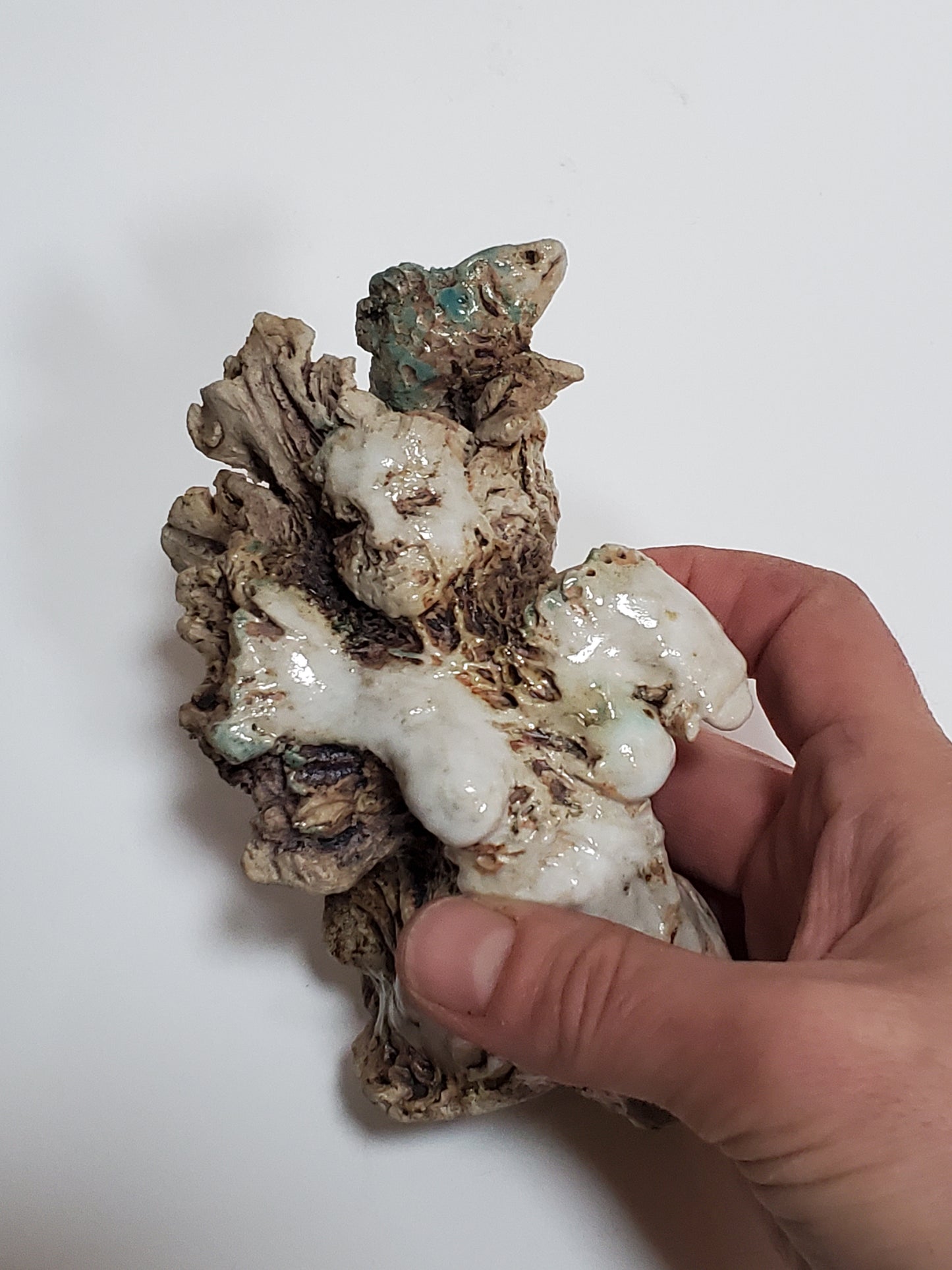 Set of 2 miniature ceramic sculptures, female figure with fish and shadow, figure with double-headed snake