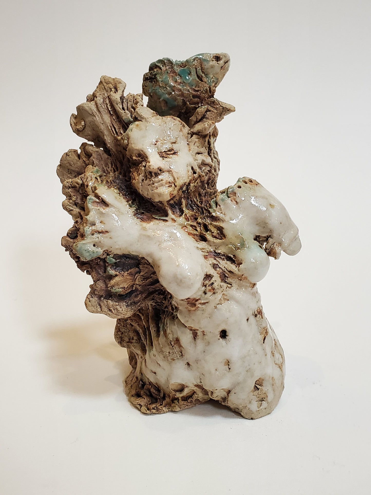 Set of 2 miniature ceramic sculptures, female figure with fish and shadow, figure with double-headed snake