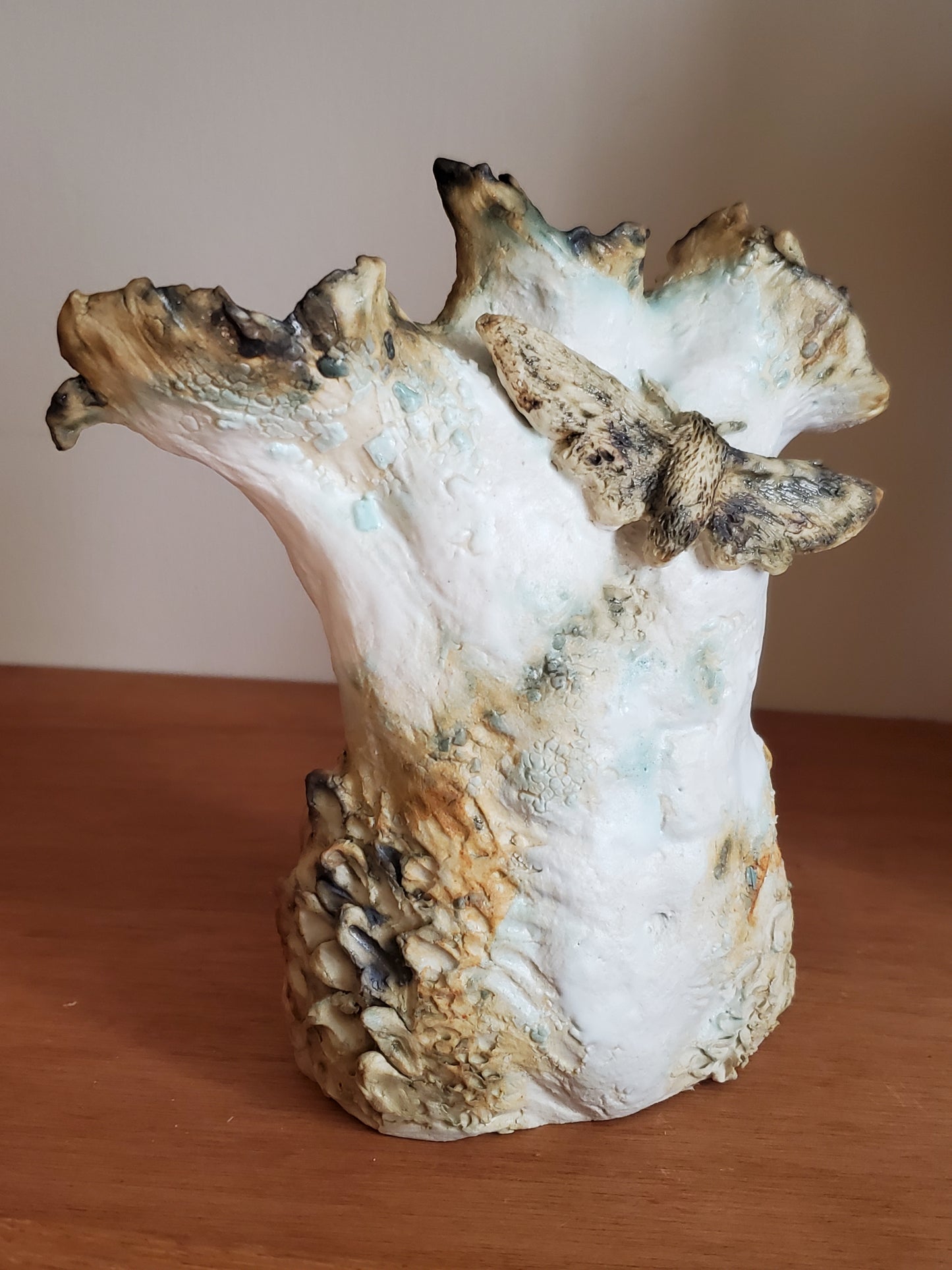 Male torso with moth, small ceramic figure sculpture
